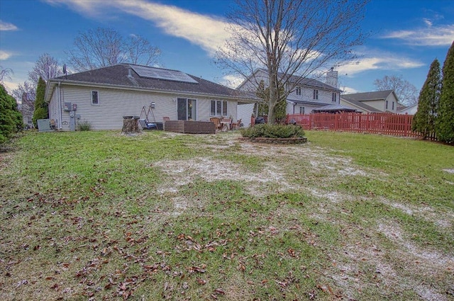 rear view of house with a yard and an outdoor hangout area