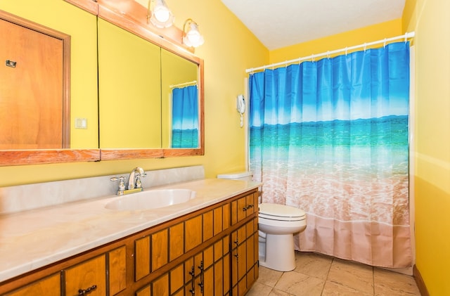 bathroom with toilet, tile patterned floors, and vanity