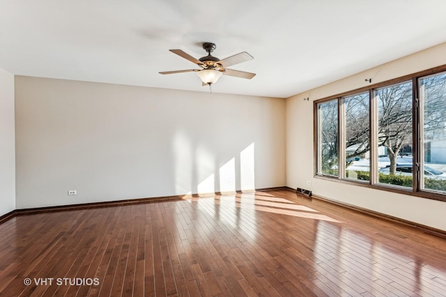 spare room featuring ceiling fan and hardwood / wood-style floors