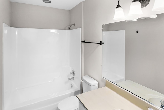 full bathroom featuring vanity,  shower combination, and toilet