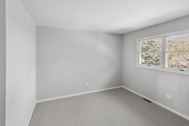 empty room with carpet flooring