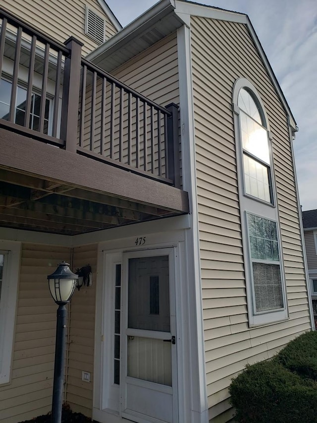 view of side of property featuring a balcony