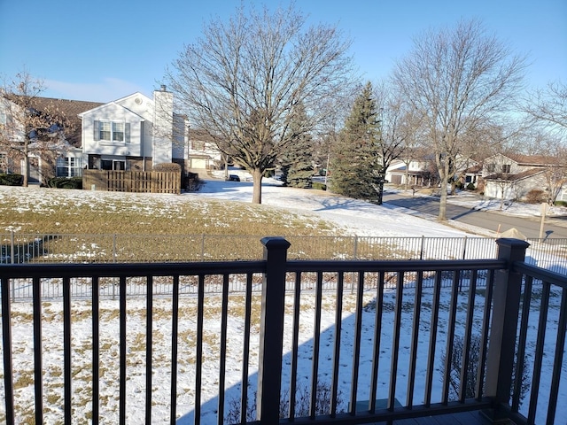 yard covered in snow with a pool