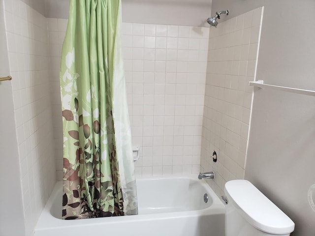 bathroom featuring toilet and shower / bath combo