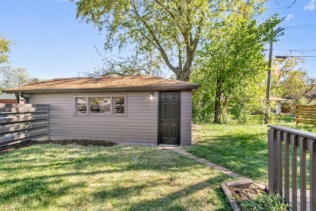 view of outbuilding featuring a lawn