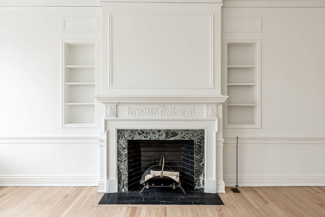 room details featuring hardwood / wood-style floors and built in features