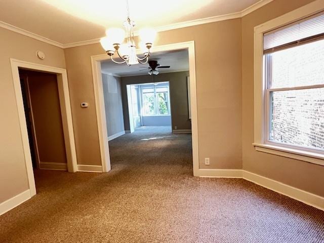 unfurnished dining area with ceiling fan with notable chandelier, carpet floors, and crown molding