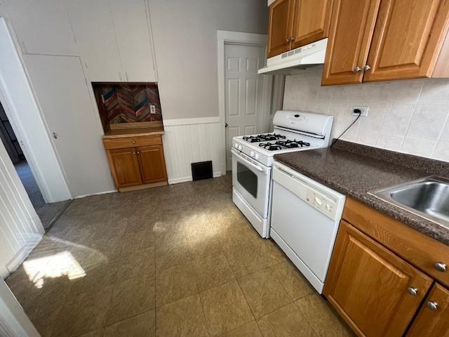 kitchen with white appliances and sink