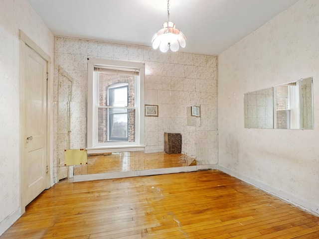 spare room with light hardwood / wood-style flooring