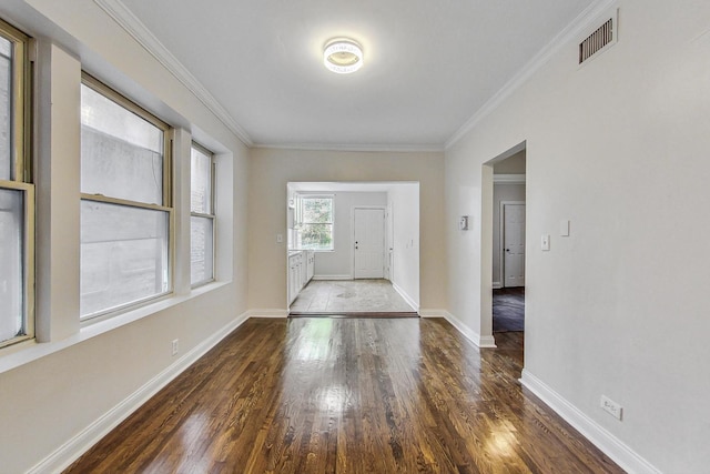 entryway featuring dark hardwood / wood-style floors and crown molding