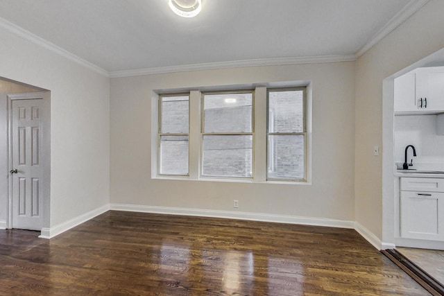 unfurnished dining area featuring a healthy amount of sunlight, crown molding, sink, and dark wood-type flooring