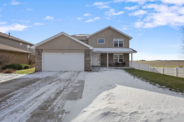 front facade with a garage and covered porch