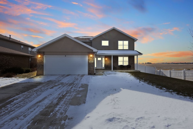 front of property with a garage and covered porch