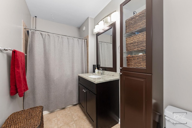 1111 S Wabash Ave Unit 808, Chicago, IL 60605 - bathroom with tile patterned floors, vanity, toilet, and a shower with shower curtain
