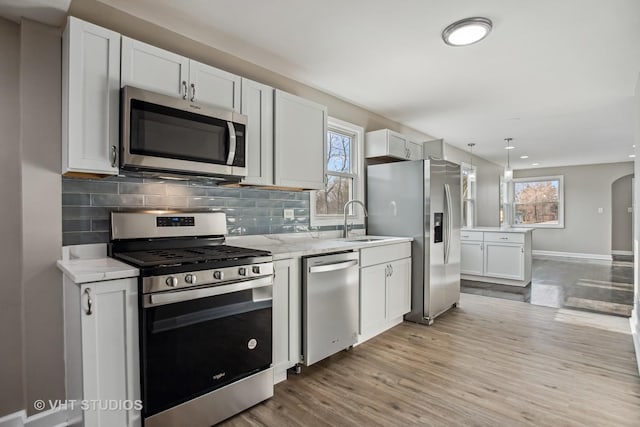 kitchen with white cabinetry, sink, and appliances with stainless steel finishes