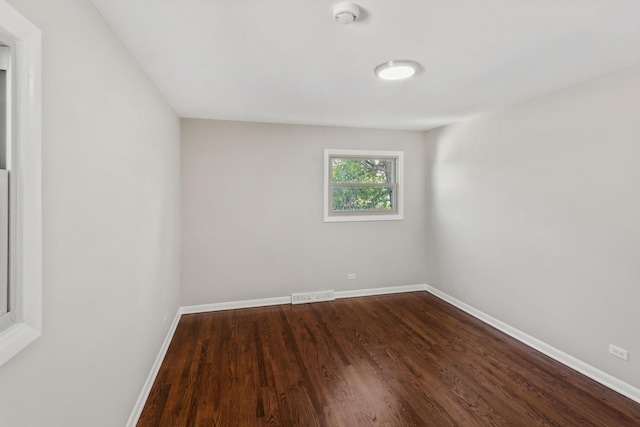 spare room with wood-type flooring