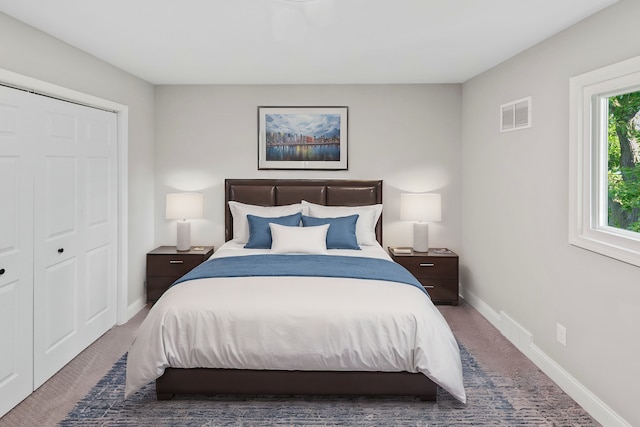 carpeted bedroom featuring a closet