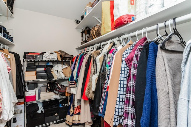 spacious closet with carpet flooring