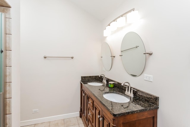 bathroom with tile patterned floors and vanity