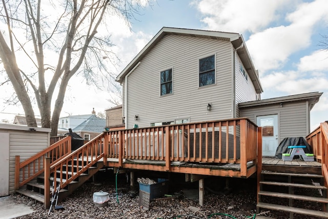 rear view of property with a wooden deck