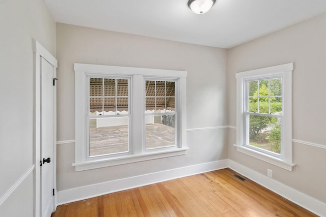 unfurnished room featuring hardwood / wood-style floors