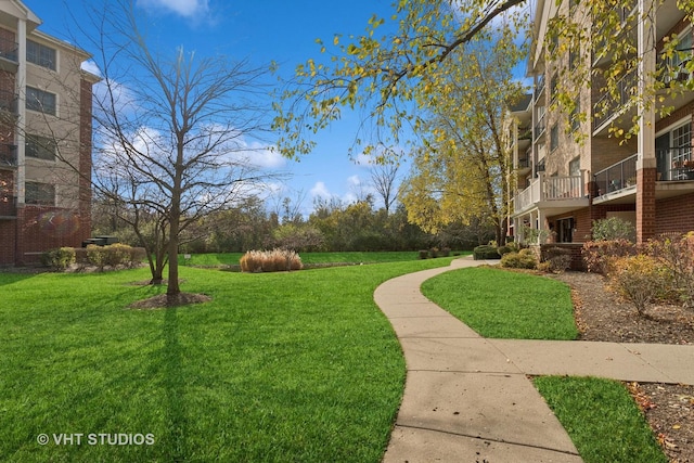 view of home's community featuring a lawn