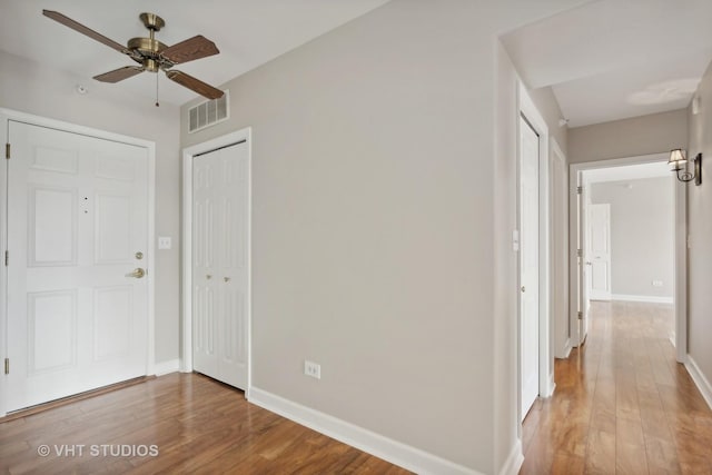 foyer featuring ceiling fan and wood-type flooring