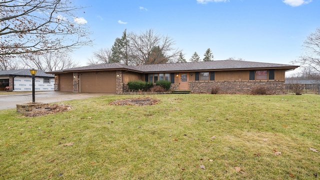 ranch-style house featuring a garage and a front lawn