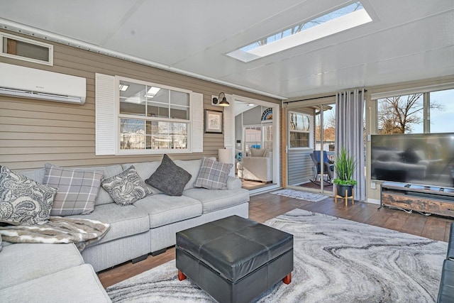 living room featuring a skylight, dark hardwood / wood-style floors, a wall mounted AC, and wooden walls