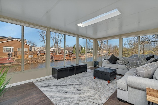 sunroom with a water view and plenty of natural light