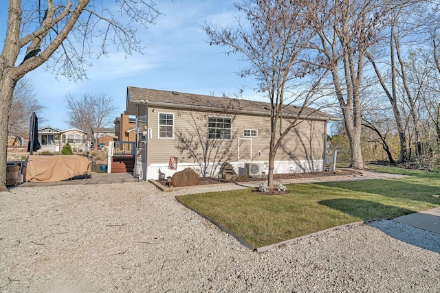 rear view of house with a yard