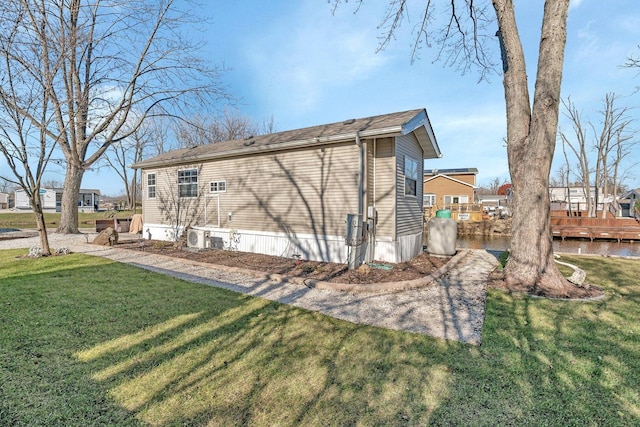 view of property exterior with a lawn