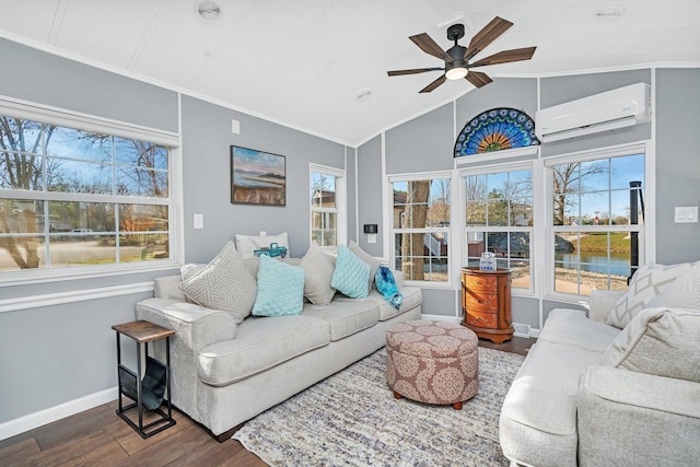 living room with dark wood-type flooring, a water view, ceiling fan, a wealth of natural light, and a wall unit AC