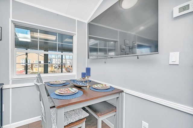 dining area with crown molding