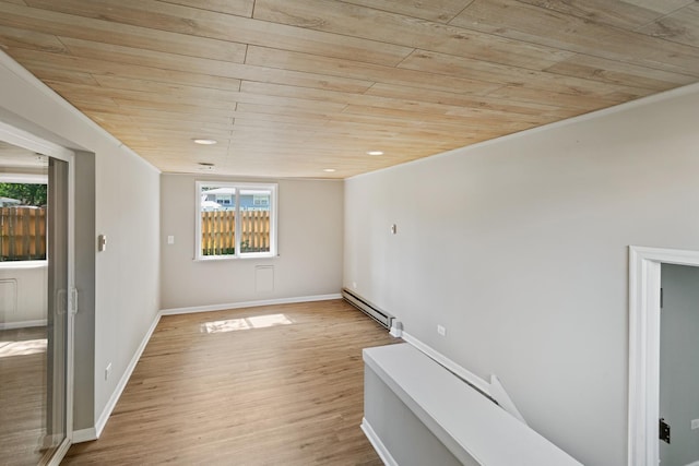 empty room with baseboard heating, a healthy amount of sunlight, wood ceiling, and light wood-type flooring