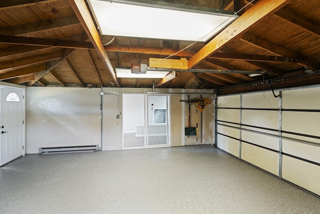 garage featuring a garage door opener and a baseboard heating unit