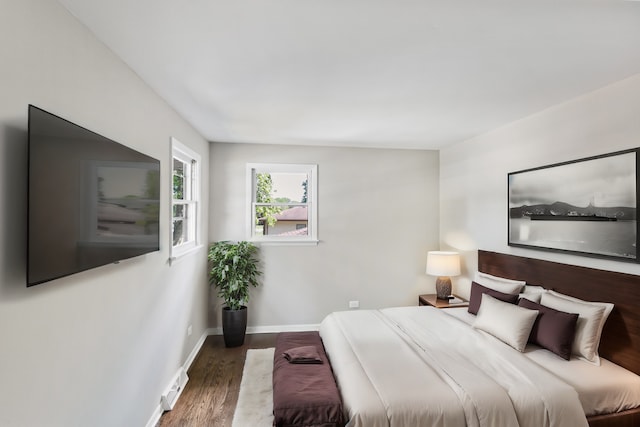 bedroom featuring dark wood-type flooring