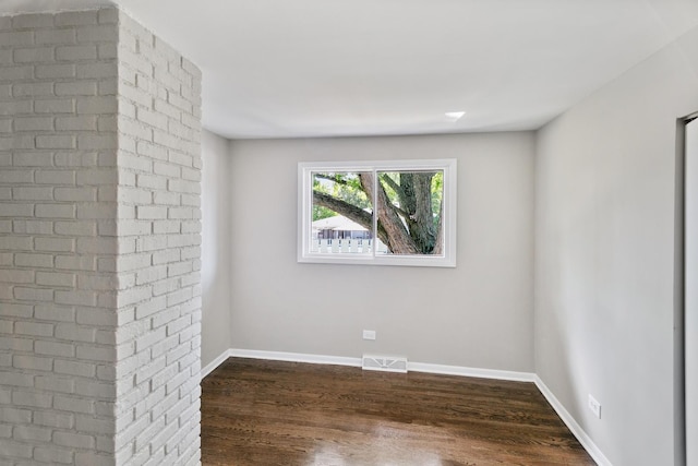 empty room featuring dark hardwood / wood-style floors