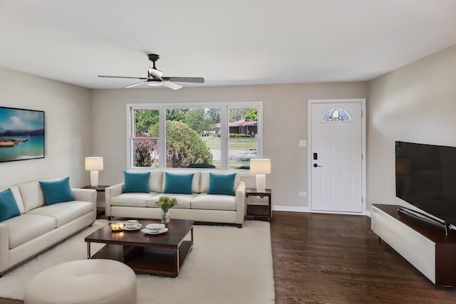 living room with dark hardwood / wood-style floors and ceiling fan