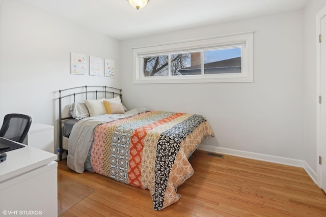 bedroom with light hardwood / wood-style floors