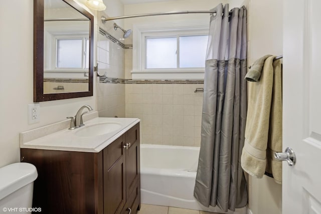 full bathroom with shower / bath combo with shower curtain, plenty of natural light, vanity, and toilet