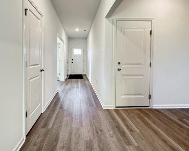 hall with hardwood / wood-style floors