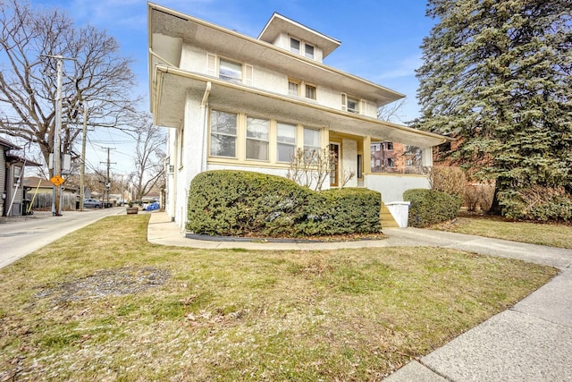 view of front facade featuring a porch and a front lawn