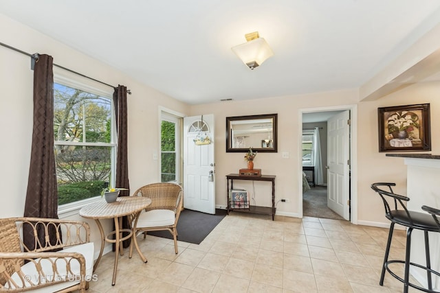 sitting room with light tile patterned floors