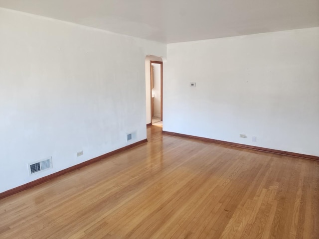 spare room with light hardwood / wood-style floors