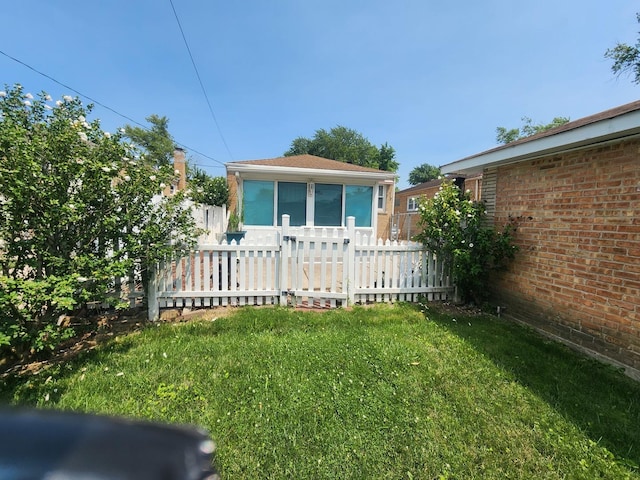 view of home's exterior with a yard