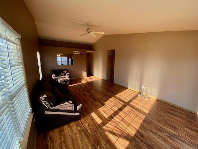 interior space featuring ceiling fan, vaulted ceiling, and hardwood / wood-style flooring