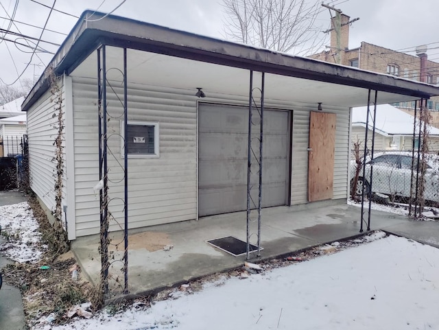 exterior space featuring a carport and a garage