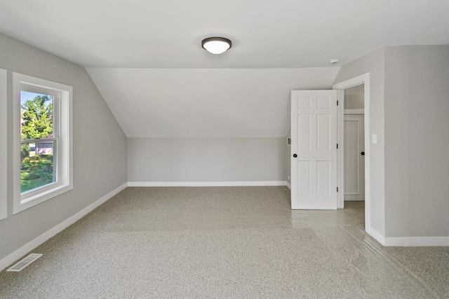 bonus room featuring vaulted ceiling