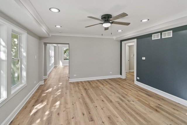 empty room featuring light hardwood / wood-style floors, ceiling fan, and ornamental molding